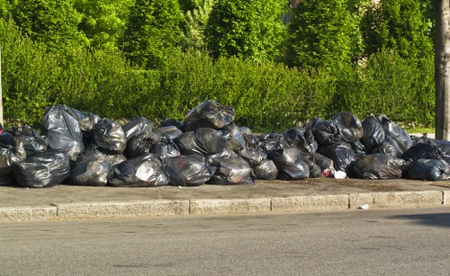 Professional waste clearance staff at work in a North West London business premises